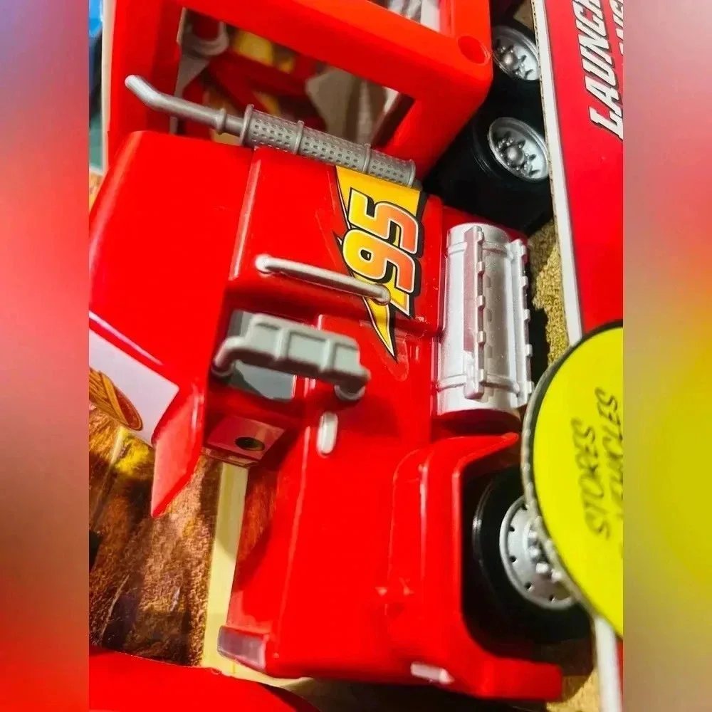 Disney Pixar Cars Launching Mack Transporter Truck Playset - Red Dinoco Transpor